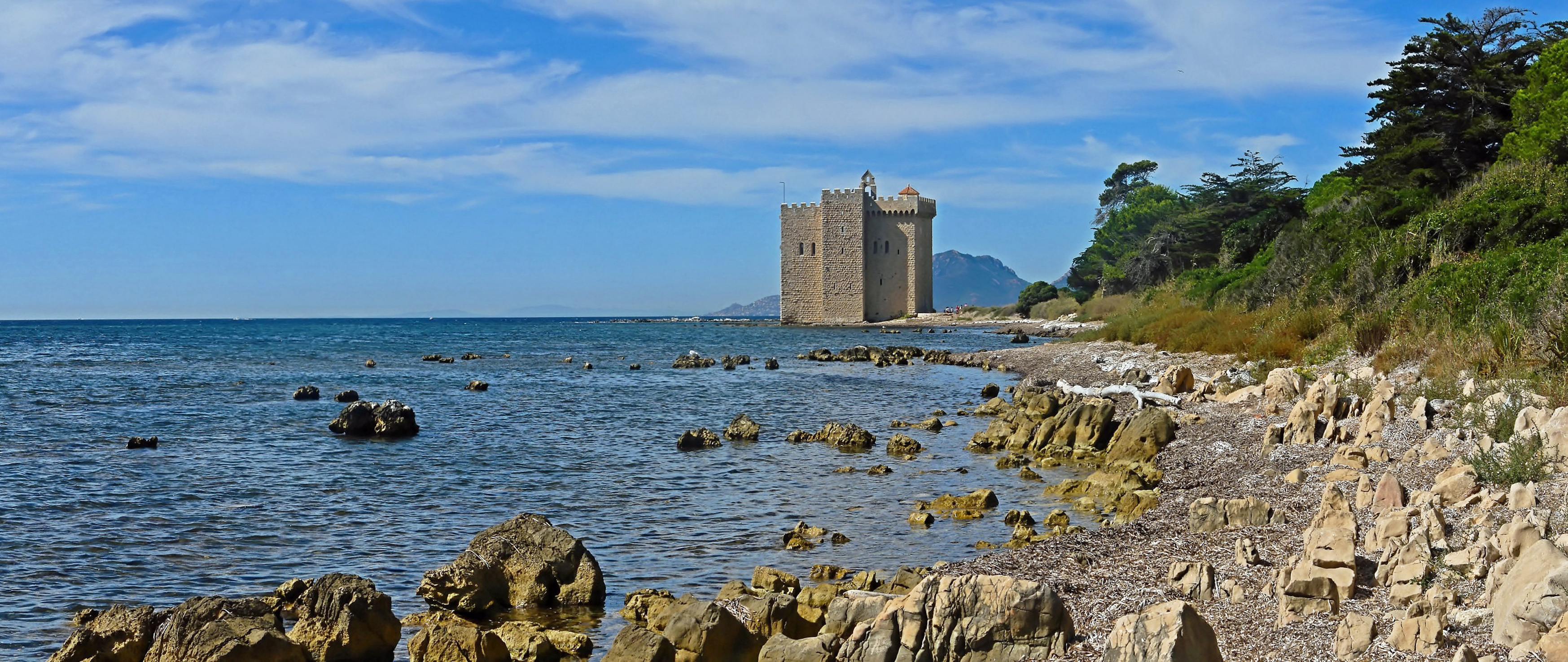 Old fortified monastery of the Lérins Abbey, on the island of Saint-Honorat, one of the Lérins Islands, next to Cannes.  Building started in 1073 to protect the monks from the attacks of Saracen pirates. The picture was obtained after stiching 3 pictures.
